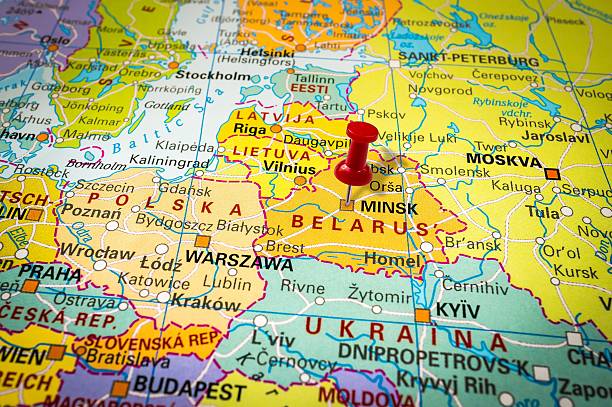 istock Red thumbtack in a map, pushpin pointing at Minsk 547404474