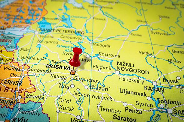 istock Red thumbtack in a map, pushpin pointing at Moscow 547404880