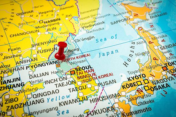 istock Red thumbtack in a map, pushpin pointing at Pyongyang 547405354