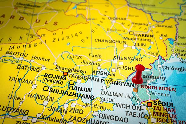istock Red thumbtack in a map, pushpin pointing at Pyongyang 547405390