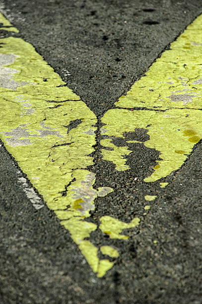 Old Signal Closeup signaling shaped arrow on the pavement of a highway seta stock pictures, royalty-free photos & images