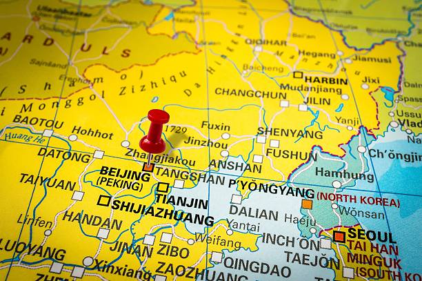 istock Red thumbtack in a map, pushpin pointing at Peking 547405748