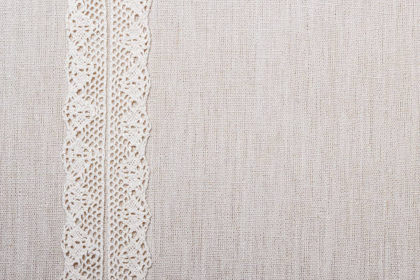 istock Lace ribbon on linen cloth background 547408324