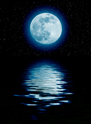 blue moon over the sea with starts