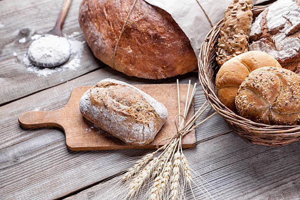istock Delicious fresh bread on wooden background 547409528