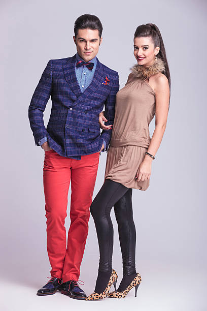 istock young fashion couple standing 547410340