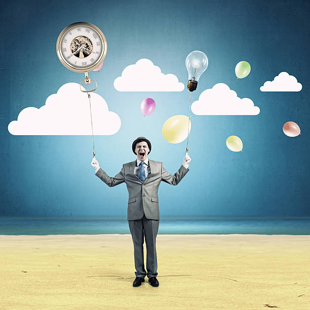 istock Comedian man with color balloons . Mixed media 547412590