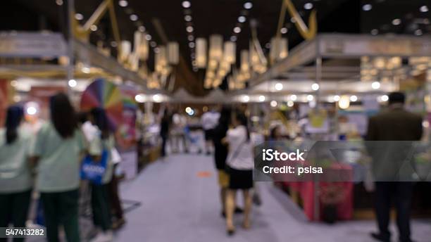 People Shopping In Exhibiton Trade Fair Blur Stock Photo - Download Image Now - Tradeshow, Agricultural Fair, Business