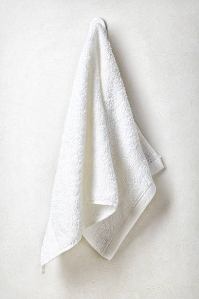 istock Clean and soft towel hanging at bathroom wall 547413848