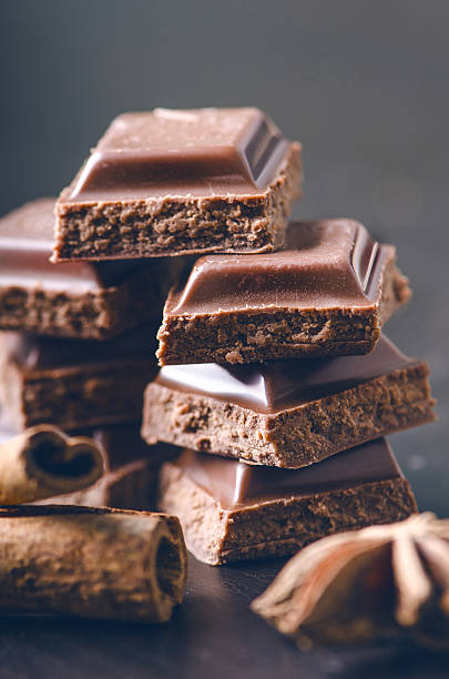 istock Two chocolate buildings on a dark background. energy and sugar. 547414000