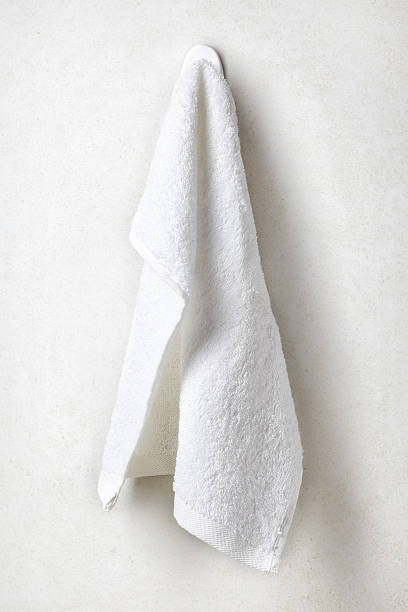 istock Clean and soft towel hanging at bathroom wall 547414002