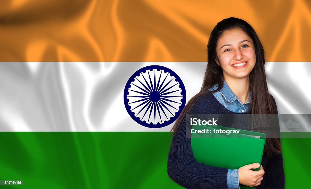 Teen student smiling over Indian flag Teen student smiling over Indian flag. Concept of lessons and learning of foreign languages. Culture of India Stock Photo
