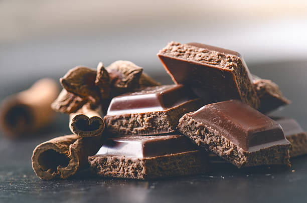 istock Two chocolate buildings on a dark background. energy and sugar. 547414222
