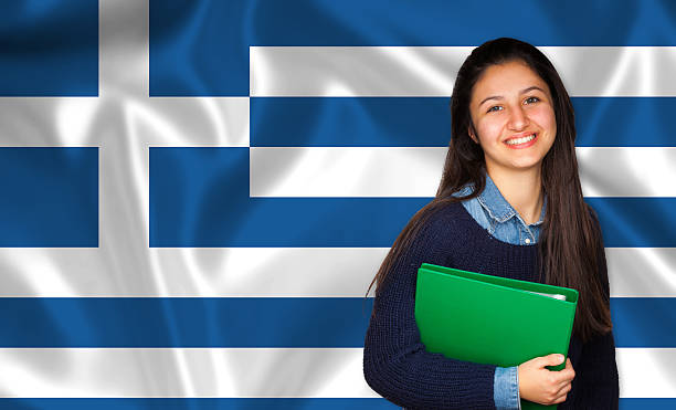 teen student lächelnd über griechische flagge - adolescence flag university people stock-fotos und bilder