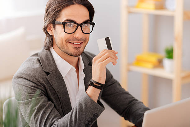istock Cheerful handsome businessman sitting at the table 547416640