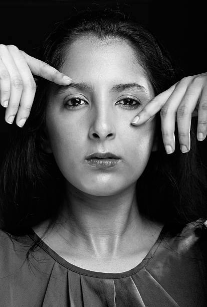 istock girl with hands next to face 547416986