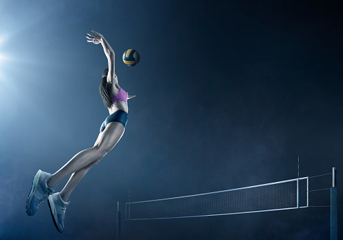 Voleibol: Hermosa jugadora femenina en acción photo