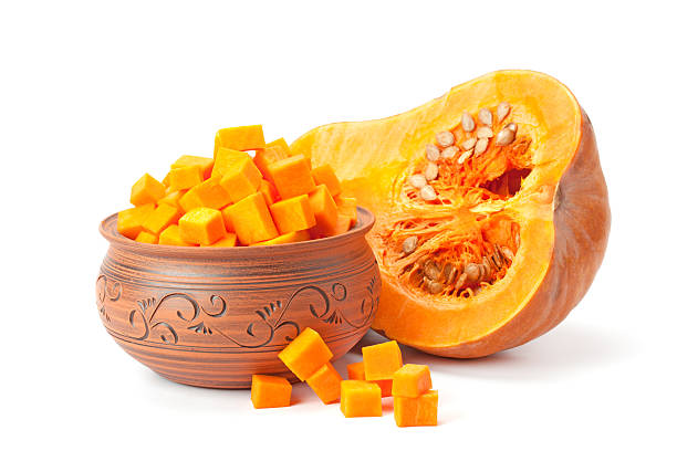 istock piece of pumpkin,   cubes in a clay pot 547417594