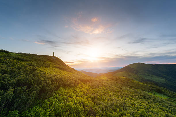 istock Colorful alpine sunset with silhouette of man 547417656