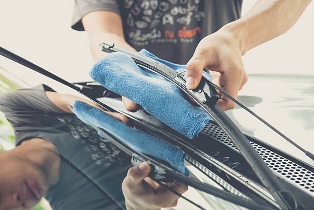 istock Hand wipe the windscreen wiper with cloth 547420302
