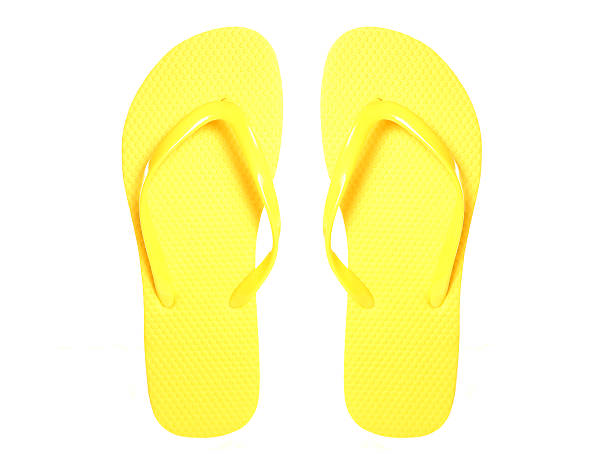 istock Pair of yellow flip flops 547421580