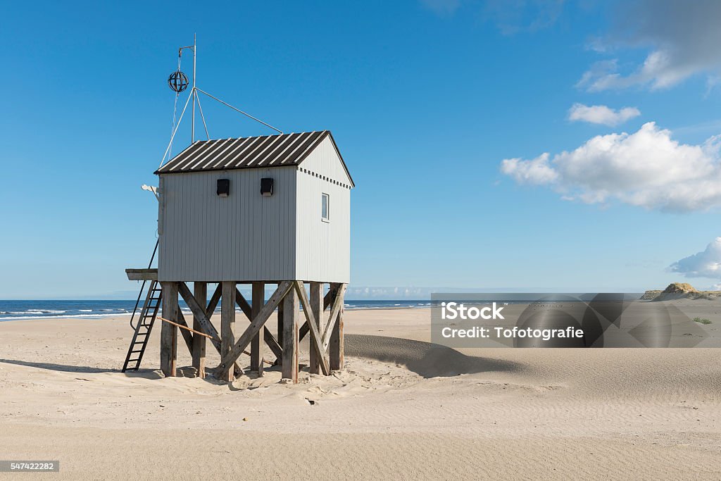 Beach hut in the Netherlands. Famous authentic wooden beach hut, for shelter, on the island of Terschelling in the Netherlands.. Terschelling Stock Photo