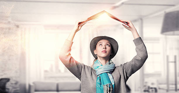 istock Student girl with book in hands . Mixed media 547423064