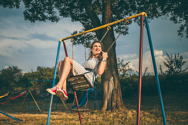 istock Joyful girl swinging 547423808