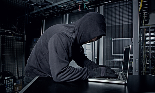 Hacker operating in server rooms
