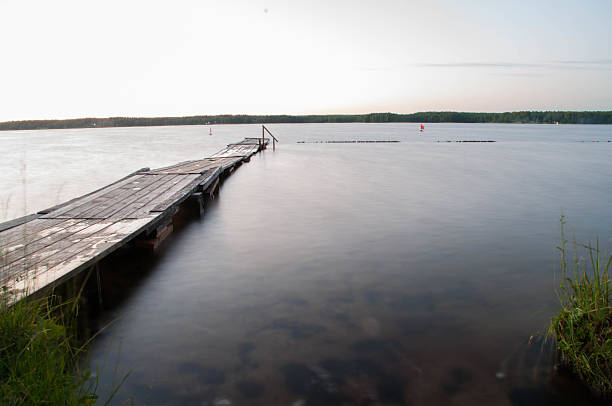 istock footbridge on the lake at sunset 547426286