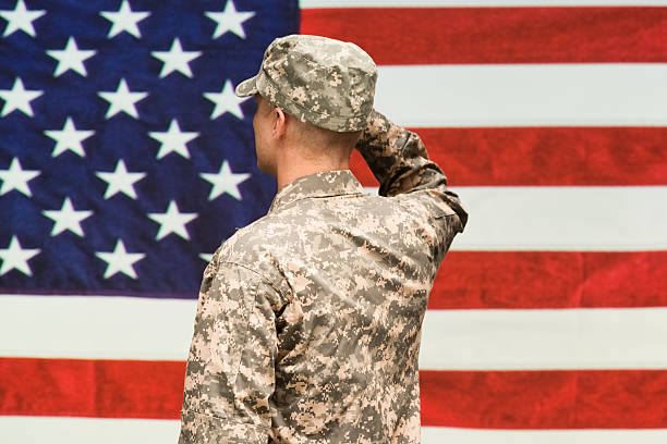 istock Rear view of soldier saluting 547426292