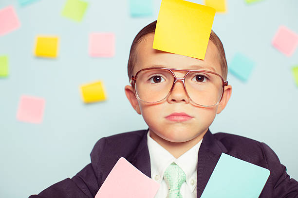 istock Young Businessman at Desk Covered with Blank Sticky Notes 547426830