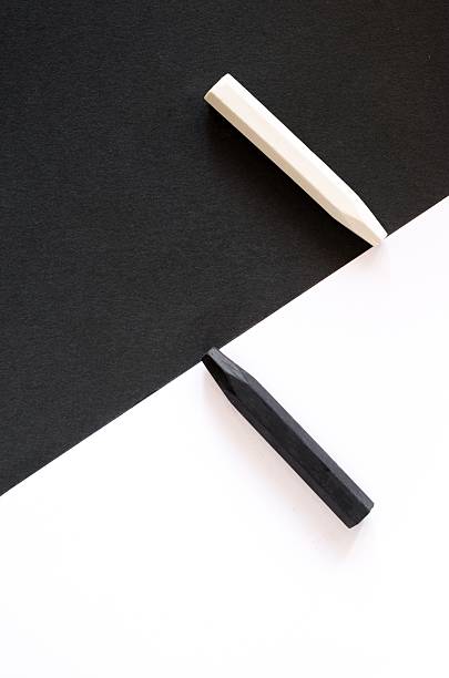 istock black and white crayons on alternate background of  same colo 547427282