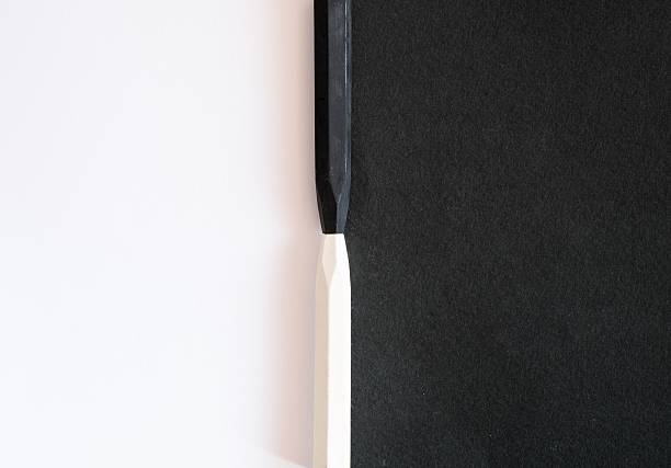 istock black and white crayons on alternate background of  same colo 547427350