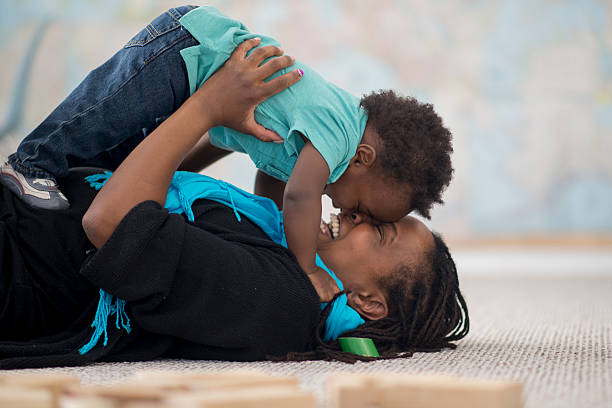 istock Mother Cuddling with Her Toddler 547428350