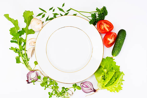 istock Fresh Spring Vegetables, Greens and Empty  Plate with Place for 547428886