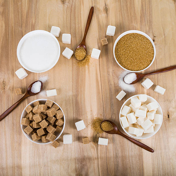 istock Cane and white sugar in a white bowls 547429294