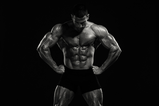 Strong Muscular Men. Black and White Image. Copy Space
