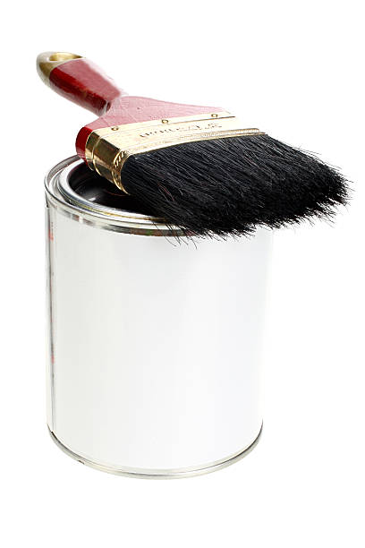 istock Paint can with blank white label and paintbrush isolated 547431318