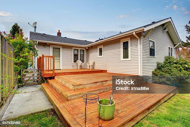 Picture Of Large Wooden Back Deck With Two Chairs Stock Photo - Download Image Now - Deck, House, Small