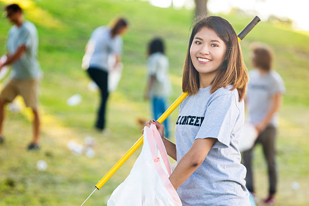 istock Confident woman helps with park clean up 547437646