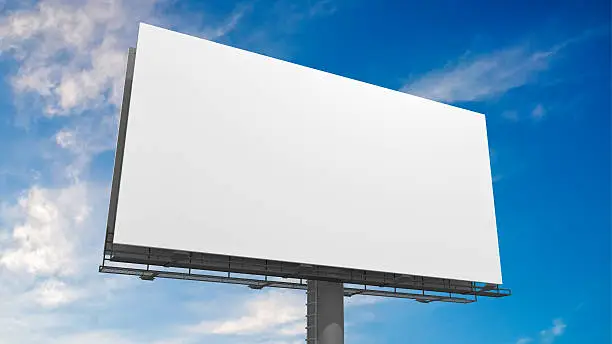 Photo of 3D illustration of blank white billboard against blue sky.