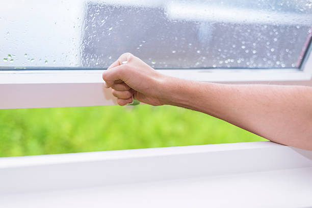 istock closing window with rainy weather outside 547439086