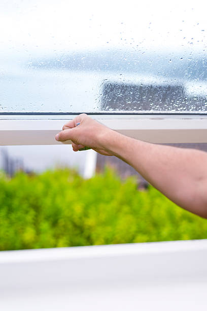 istock closing window with rainy weather outside 547439094