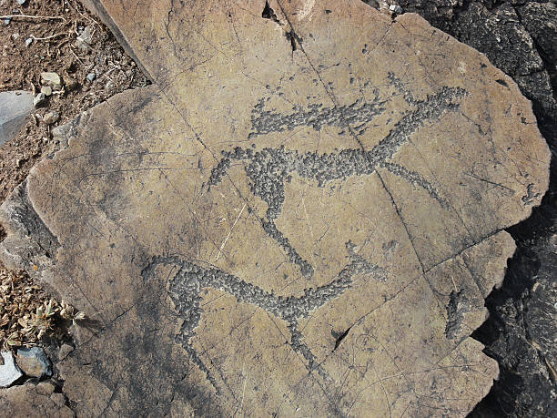 istock Running animals petroglyphs carved in rocks 547443084