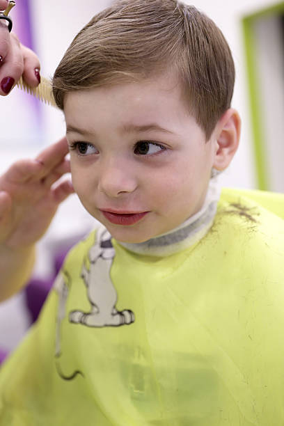 istock Kid at the barbershop 547443742