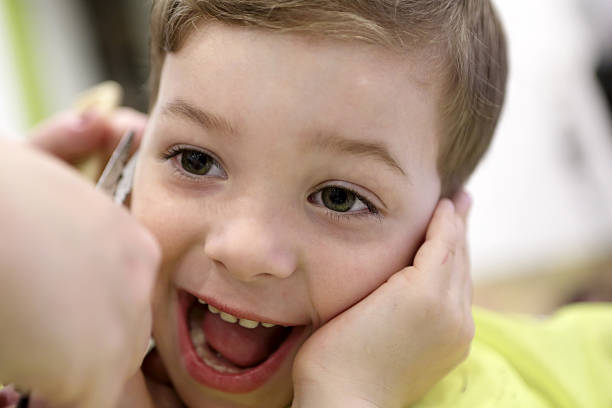 istock Laughing boy at the barbershop 547443806