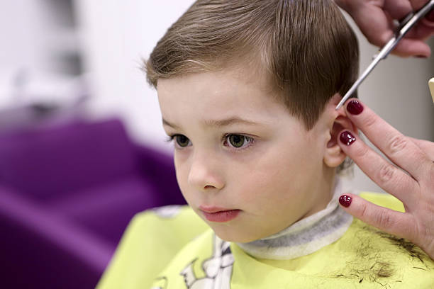 istock Serious kid at the barbershop 547443890