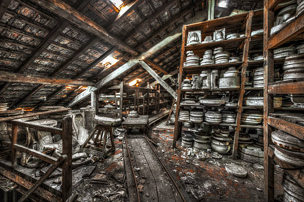 Shelves of clay moulds at an abandoned ceramics factory stock photo