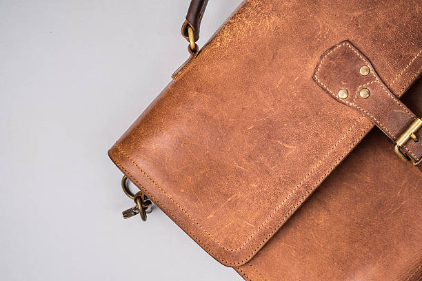 istock Brown Vintage leather briefcase with strap and brass buckle, 547444778